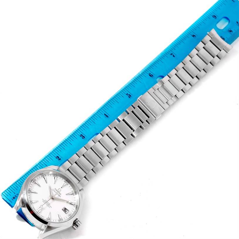 The image shows the Omega Aqua Terra 231.10.42.21.02.001 Men
s Stainless Steel Silver Dial 231.10.42.21.02.001 Men
s Stainless Steel Silver Dial watch and its stainless steel bracelet from a top-down angle, with a ruler measuring its length.