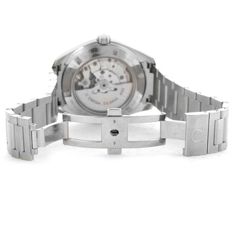The image shows the Omega Aqua Terra 231.10.42.21.02.001 Men
s Stainless Steel Silver Dial 231.10.42.21.02.001 Men
s Stainless Steel Silver Dial watch from the back, highlighting the open clasp and the watch
s exposed mechanism.