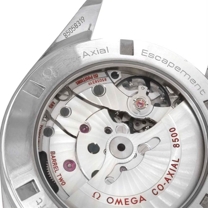 The image shows the back of the Omega Aqua Terra 231.10.42.21.02.001 Men
s Stainless Steel Silver Dial 231.10.42.21.02.001 Men
s Stainless Steel Silver Dial watch, highlighting the Co-Axial escapement and movement components.