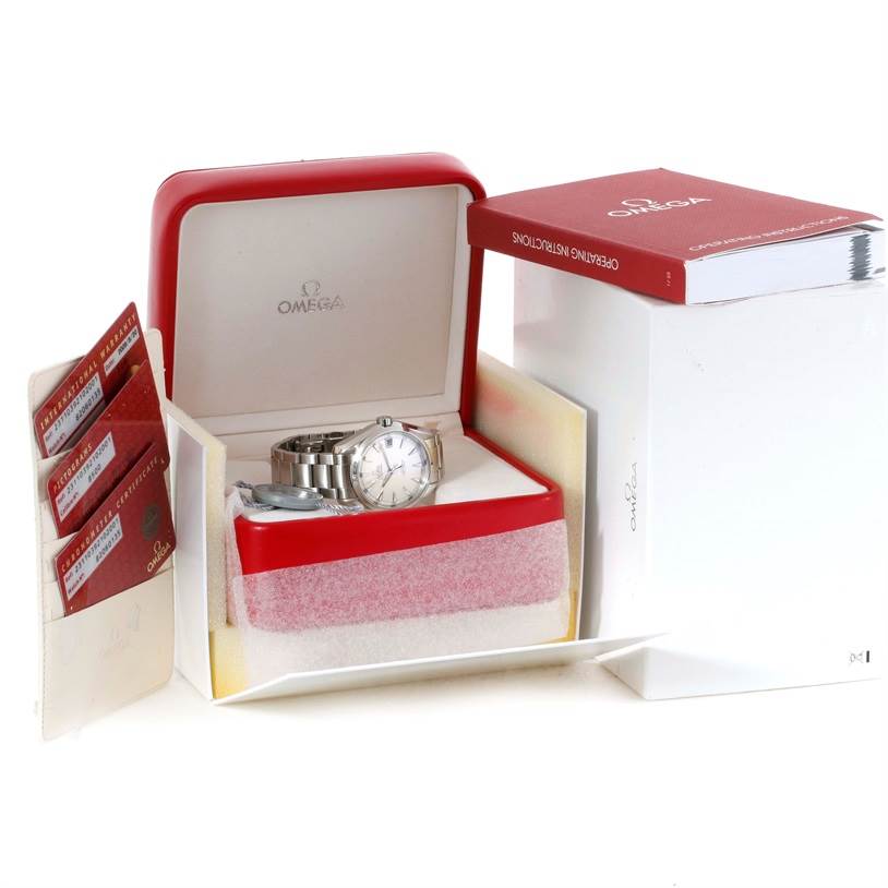 The image shows an Omega Aqua Terra 231.10.39.21.02.001 Men
s Stainless Steel Silver Dial 231.10.39.21.02.001 Men
s Stainless Steel Silver Dial watch in its box along with warranty cards and a manual.