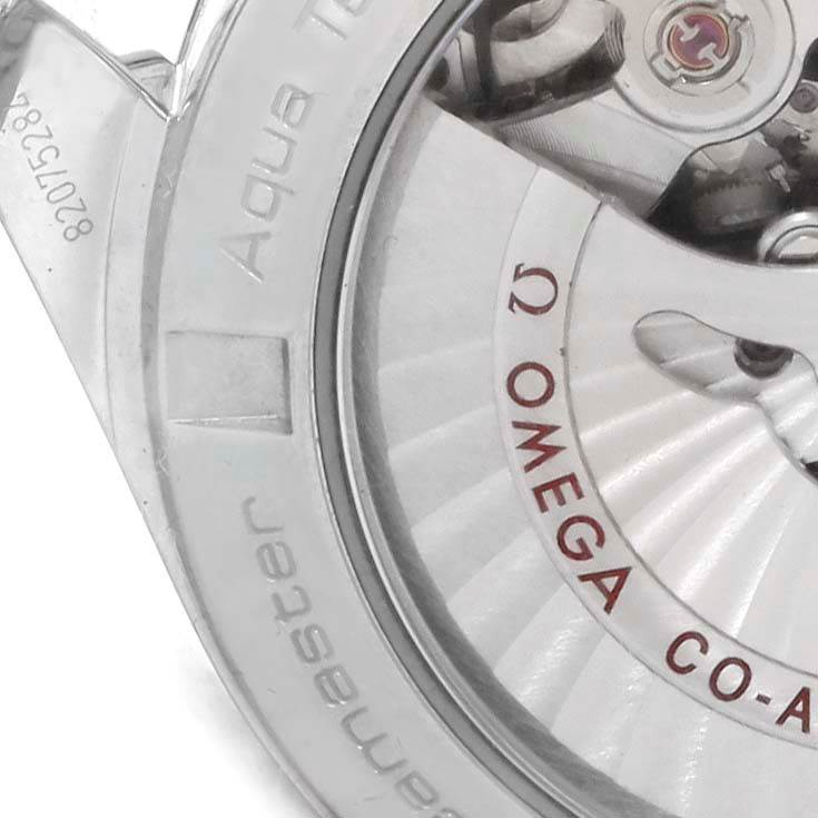 The image shows a close-up of the back of an Omega Aqua Terra 231.10.39.21.02.001 Men's Stainless Steel Silver Dial 231.10.39.21.02.001 Men's Stainless Steel Silver Dial, highlighting its Co-Axial movement and part of the casing.