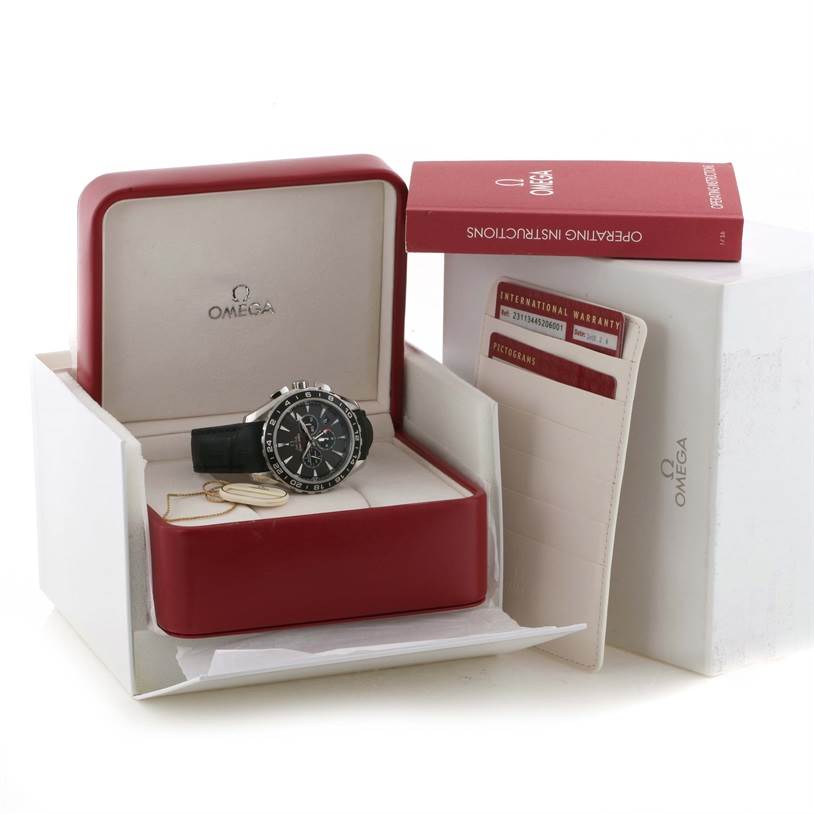 The Omega Aqua Terra 231.13.44.52.06.001 Men
s Stainless Steel Grey Dial 231.13.44.52.06.001 Men
s Stainless Steel Grey Dial watch is displayed in its open red case with warranty cards and an instruction manual beside it.