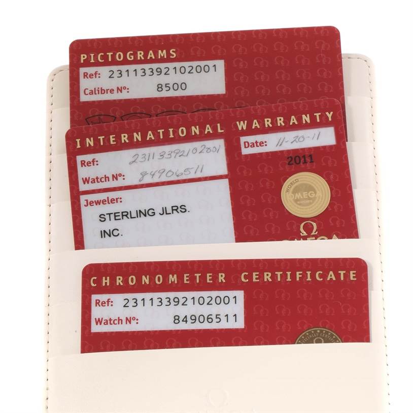 The image shows the certification cards for an Omega Aqua Terra 231.13.39.21.02.001 Men
s Stainless Steel Silver Dial 231.13.39.21.02.001 Men
s Stainless Steel Silver Dial watch, including pictograms, international warranty, and chronometer certificate.