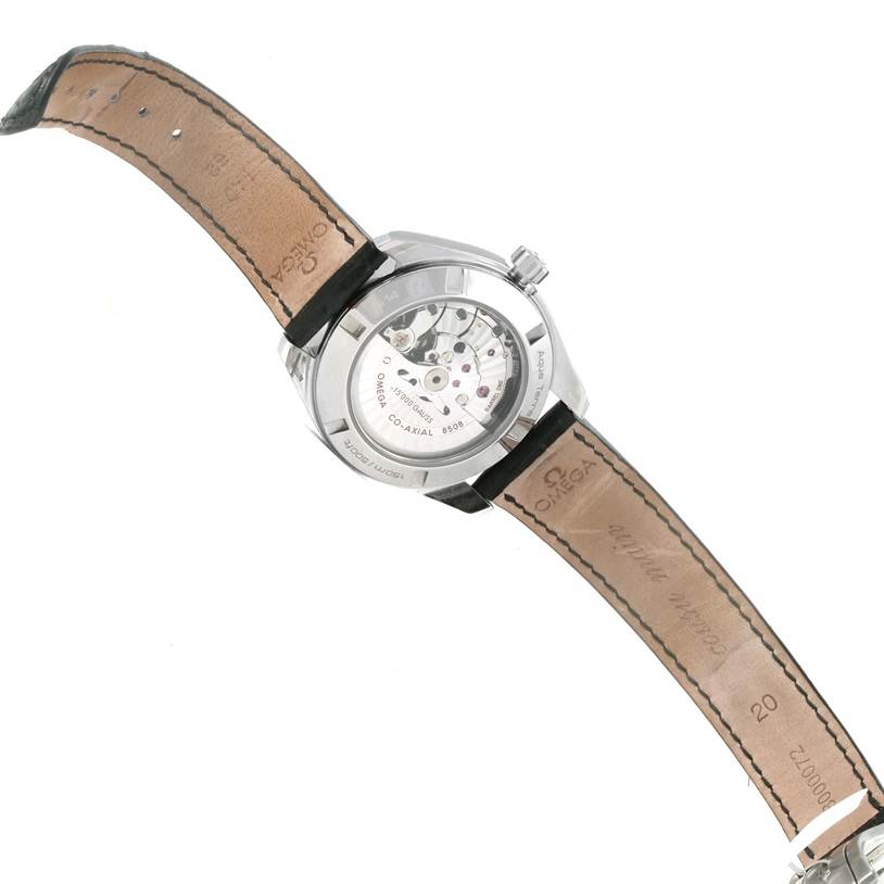 The image shows the back view of an Omega Aqua Terra 231.12.42.21.01.001 Men's Stainless Steel Black Dial 231.12.42.21.01.001 Men's Stainless Steel Black Dial watch, revealing its movement and leather strap.