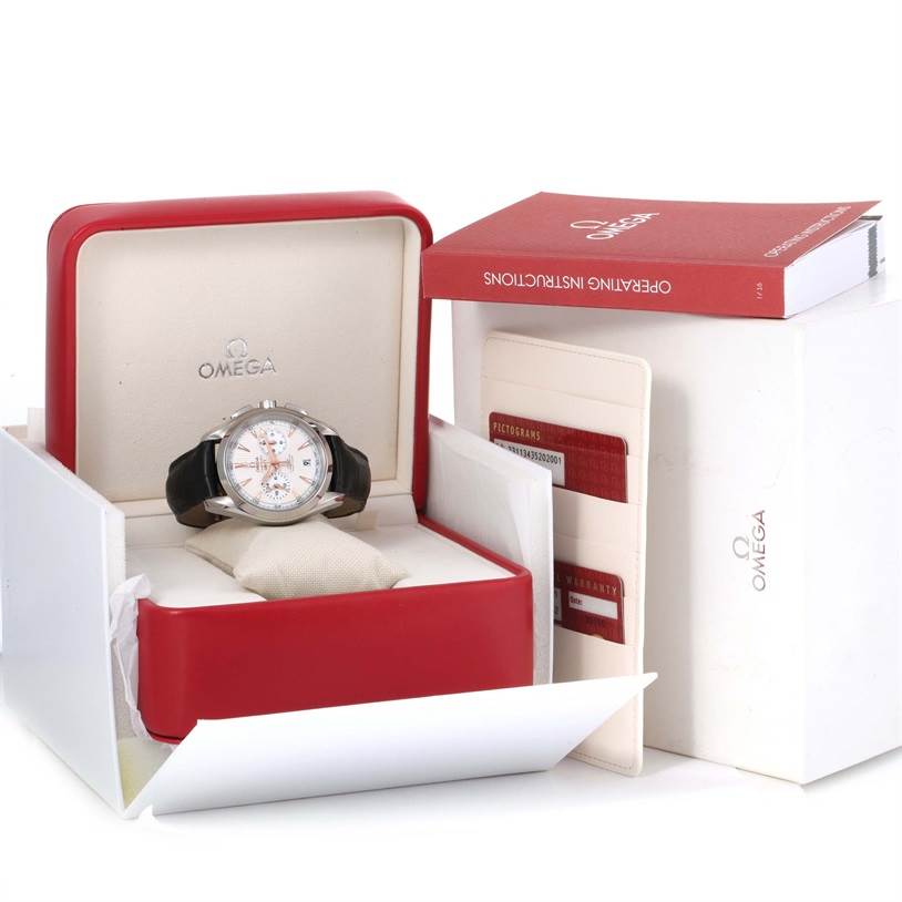 The Omega Aqua Terra 231.13.43.52.02.001 Men
s Stainless Steel Silver Dial 231.13.43.52.02.001 Men
s Stainless Steel Silver Dial watch is shown at a front angle in its open box, alongside instruction manuals and warranty cards.