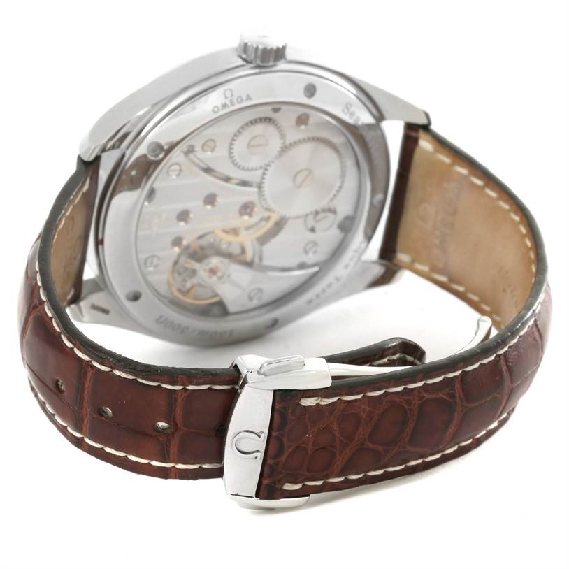 The image shows the back view of the Omega Aqua Terra 2806.52.37 Men
s Stainless Steel Black Dial 2806.52.37 Men
s Stainless Steel Black Dial watch with its mechanical movement and leather strap visible.