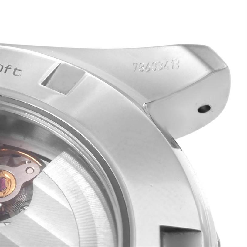 The image shows a close-up of the case back and part of the movement of the Omega Aqua Terra 231.10.44.52.06.001 Men
s Stainless Steel Grey Dial 231.10.44.52.06.001 Men
s Stainless Steel Grey Dial watch at an angled view.