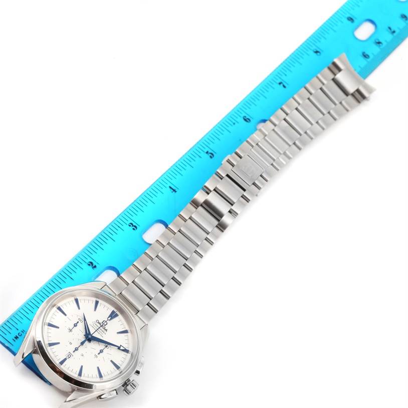 The Omega Aqua Terra 2512.30.00 Men
s Stainless Steel Silver Dial 2512.30.00 Men
s Stainless Steel Silver Dial watch is shown from a top-down angle, displaying its face, case, and metal bracelet alongside a ruler.