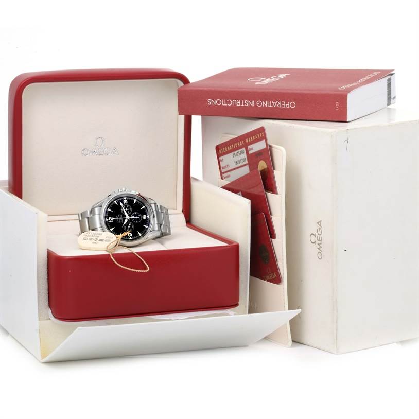 The image shows an Omega Aqua Terra 2512.52.00 Men
s Stainless Steel Black Dial 2512.52.00 Men
s Stainless Steel Black Dial watch in its open red case, accompanied by a warranty card and instruction manual.
