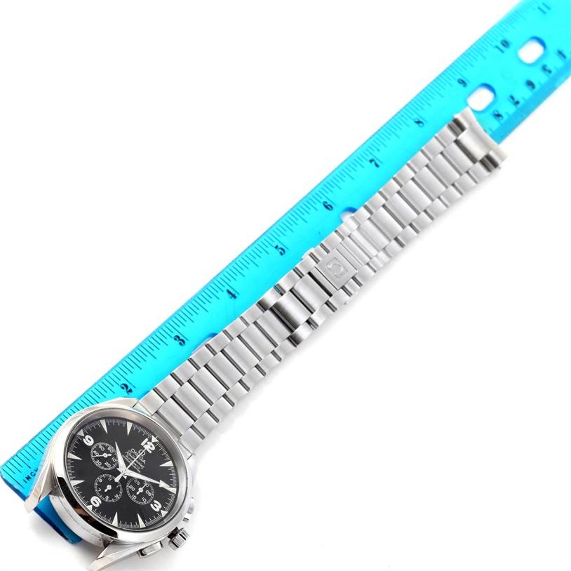 This image shows an Omega Aqua Terra 2512.52.00 Men
s Stainless Steel Black Dial 2512.52.00 Men
s Stainless Steel Black Dial watch laying flat, displaying its face and metal bracelet next to a blue ruler for scale.