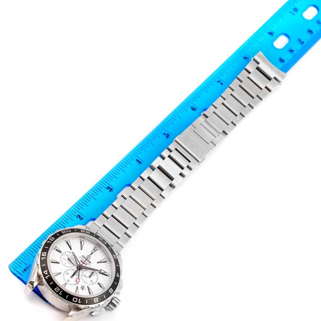 The image shows an Omega Aqua Terra 231.10.44.52.04.001 Men
s Stainless Steel White Dial 231.10.44.52.04.001 Men
s Stainless Steel White Dial watch lying flat with its stainless steel bracelet next to a blue ruler for measurement.