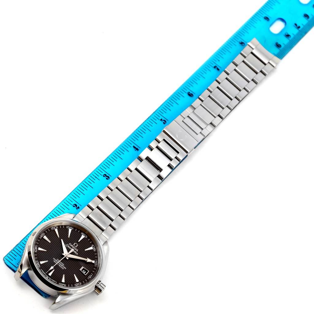 The image shows an Omega Aqua Terra 231.10.42.21.06.001 Men's Stainless Steel Grey Dial 231.10.42.21.06.001 Men's Stainless Steel Grey Dial watch laid flat with its stainless steel band measured by a ruler.