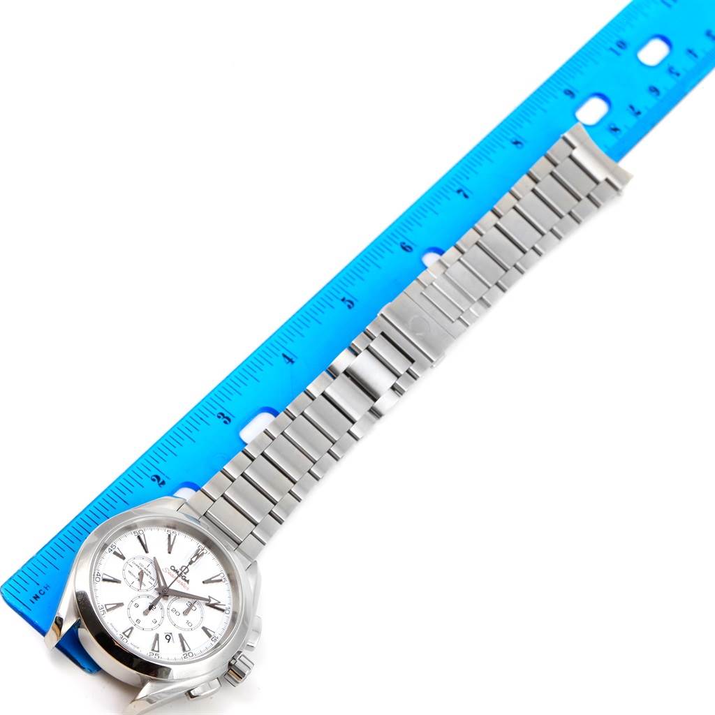 The Omega Aqua Terra 231.10.44.50.04.001 Men's Stainless Steel White Dial 231.10.44.50.04.001 Men's Stainless Steel White Dial watch is shown fully extended with the face, bracelet, and clasp visible next to a ruler for size reference.