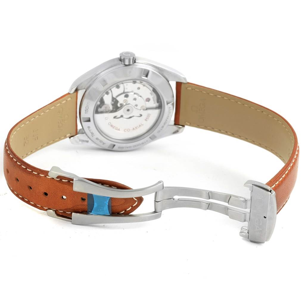 The Omega Aqua Terra 231.12.42.21.01.002 Men
s Stainless Steel Black Dial 231.12.42.21.01.002 Men
s Stainless Steel Black Dial watch is shown from the back, highlighting the movement and the leather strap with an open deployant clasp.