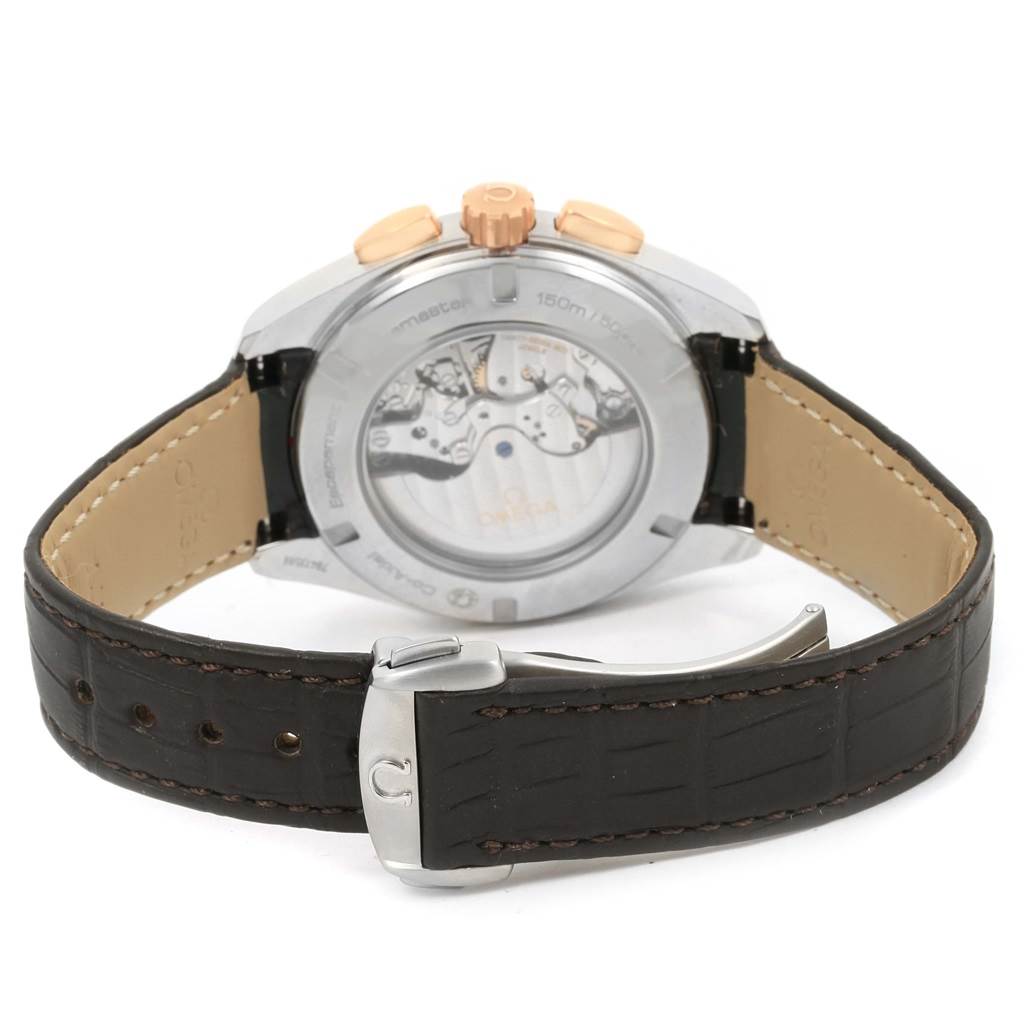 This image shows the back of the Omega Aqua Terra 231.23.44.50.06.001 Men's Steel and Gold (two tone) Grey Dial 231.23.44.50.06.001 Men's Steel and Gold (two tone) Grey Dial watch, highlighting its open case back and leather strap with a buckle clasp.