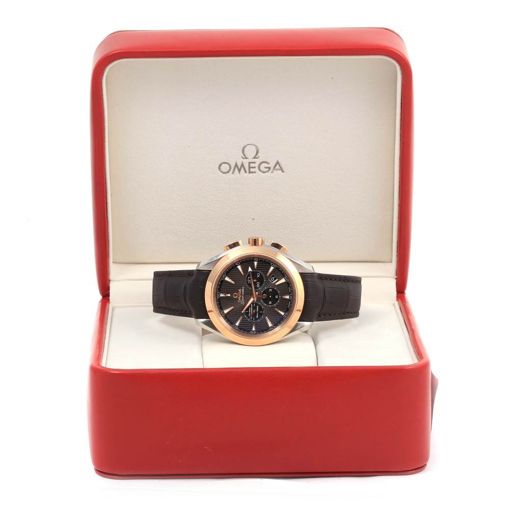 The Omega Aqua Terra 231.23.44.50.06.001 Men's Steel and Gold (two tone) Grey Dial 231.23.44.50.06.001 Men's Steel and Gold (two tone) Grey Dial model watch is shown from a frontal angle inside an open red and white watch box.