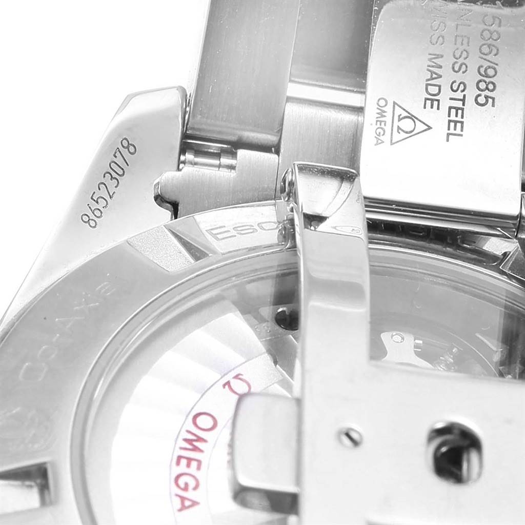 The image shows a close-up of the clasp and back case of an Omega Aqua Terra 231.10.42.21.02.001 Men
s Stainless Steel Silver Dial 231.10.42.21.02.001 Men
s Stainless Steel Silver Dial watch, highlighting the serial number and part of the movement.