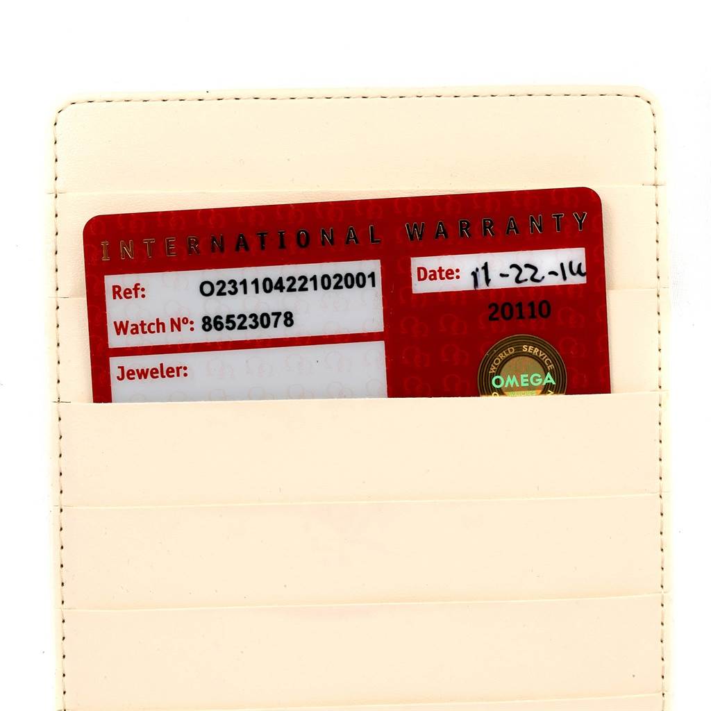 This image shows an international warranty card for an Omega Aqua Terra 231.10.42.21.02.001 Men
s Stainless Steel Silver Dial 231.10.42.21.02.001 Men
s Stainless Steel Silver Dial model watch inside a beige cardholder.