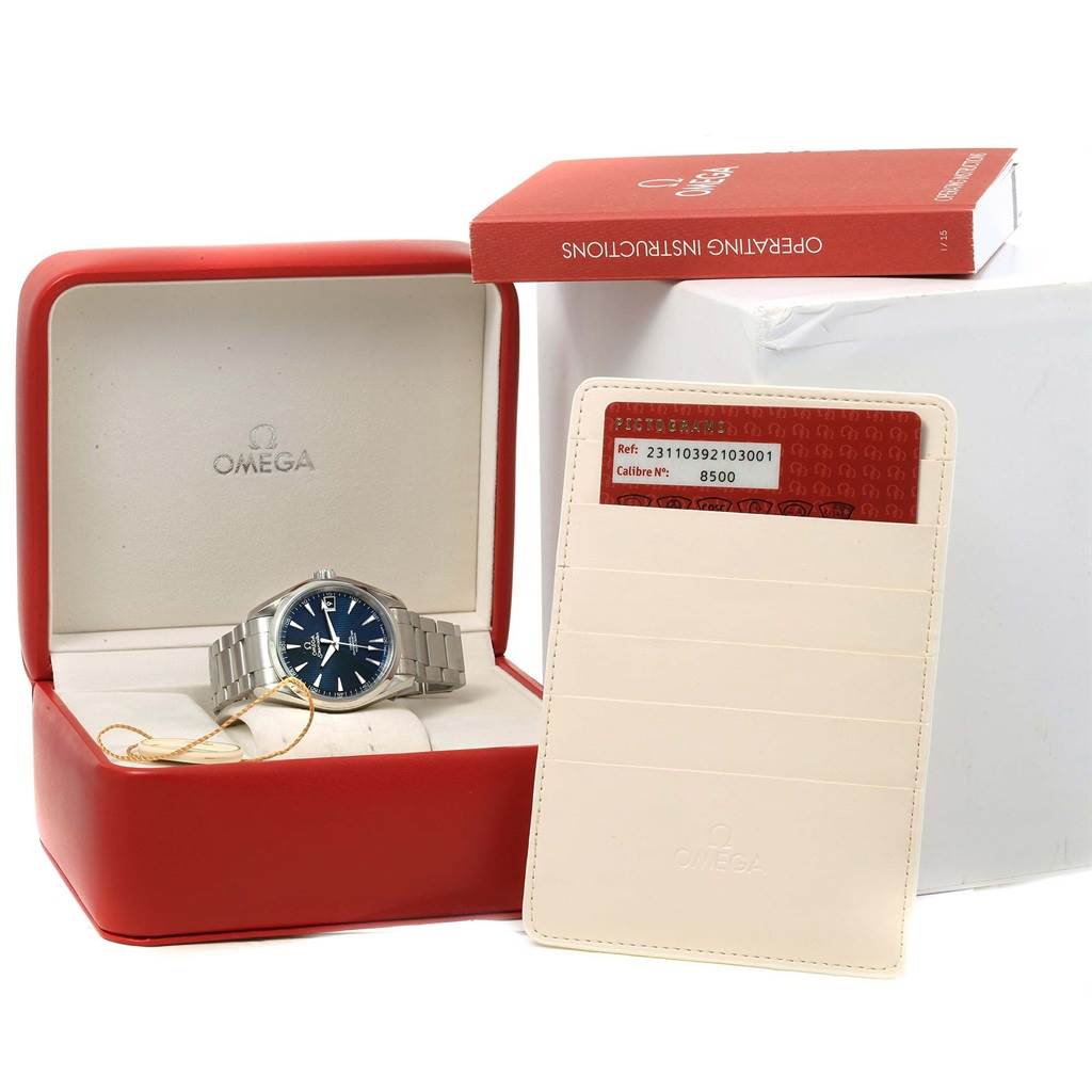 The image shows an Omega Aqua Terra 231.10.39.21.03.001 Men
s Stainless Steel Blue Dial 231.10.39.21.03.001 Men
s Stainless Steel Blue Dial watch in its packaging, alongside the operating instructions and warranty card.
