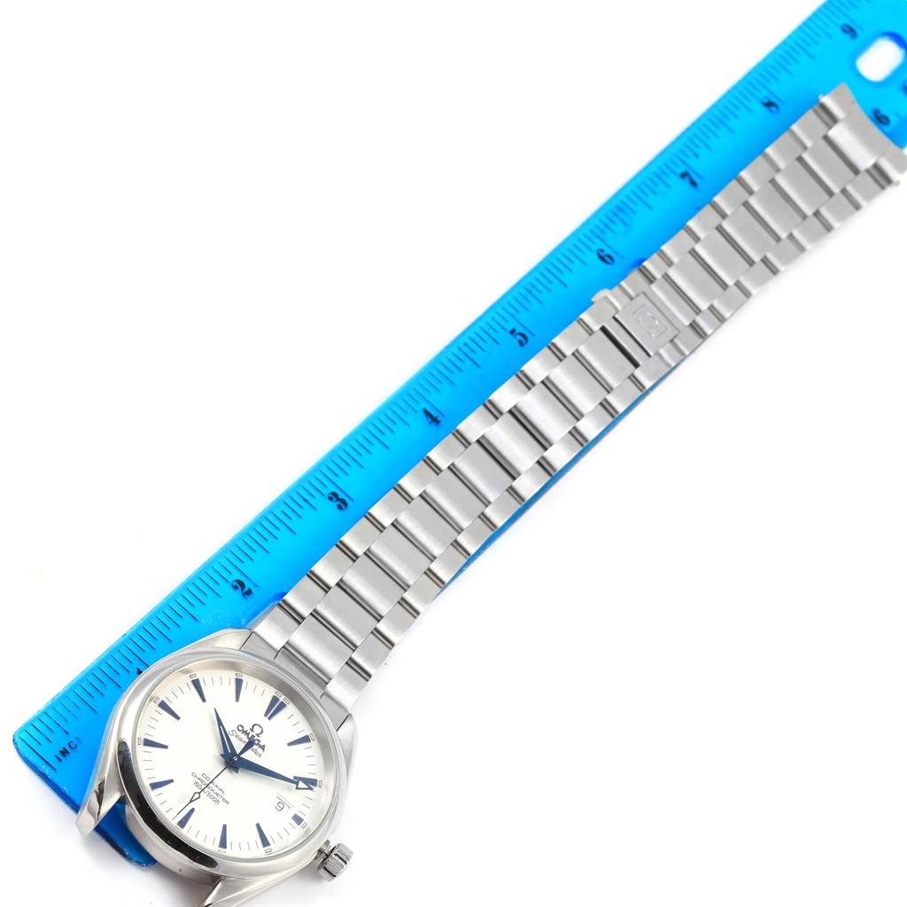 The image shows a top-down view of the Omega Aqua Terra 2503.33.00 Men
s Stainless Steel Silver Dial 2503.33.00 Men
s Stainless Steel Silver Dial watch, including its face, crown, and metal bracelet next to a ruler.