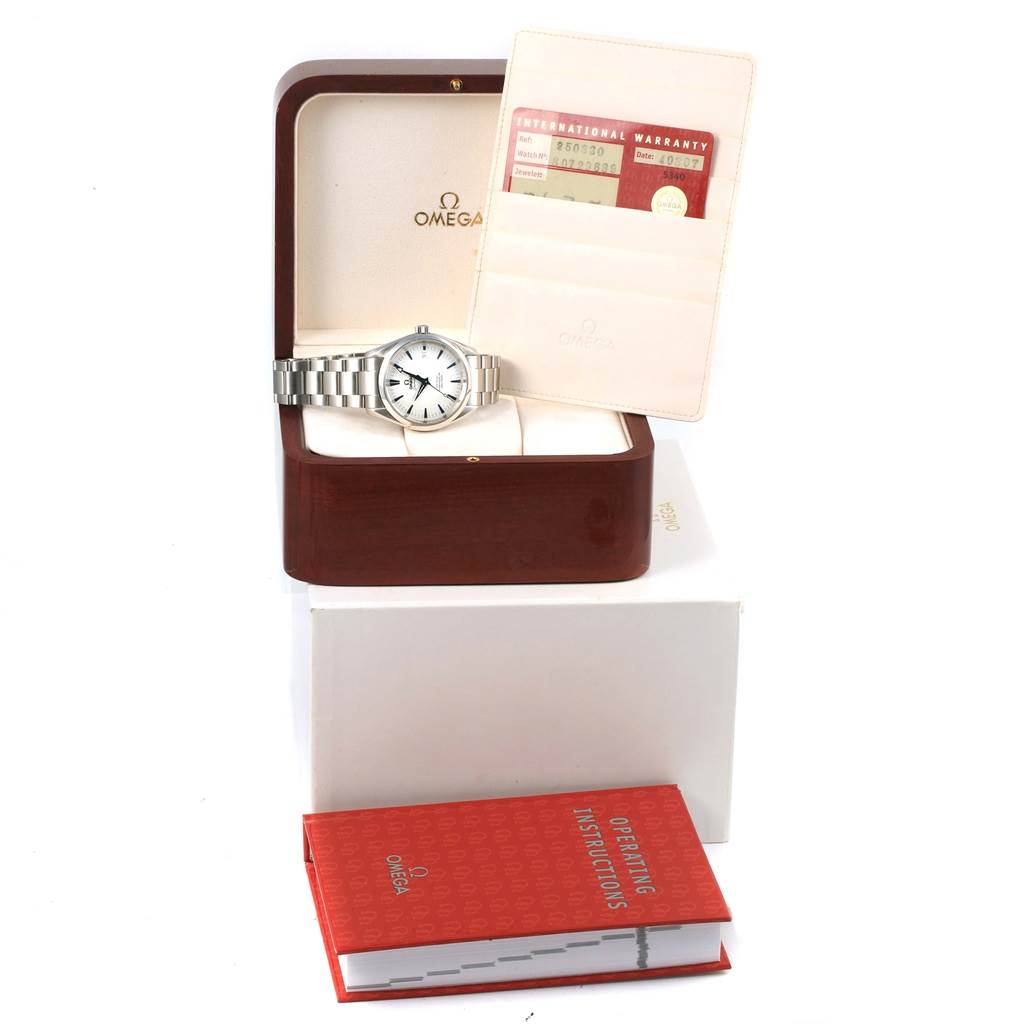 The Omega Aqua Terra 2503.33.00 Men
s Stainless Steel Silver Dial 2503.33.00 Men
s Stainless Steel Silver Dial watch is displayed in its wooden case, accompanied by warranty cards, a holder, and an operating instructions booklet.
