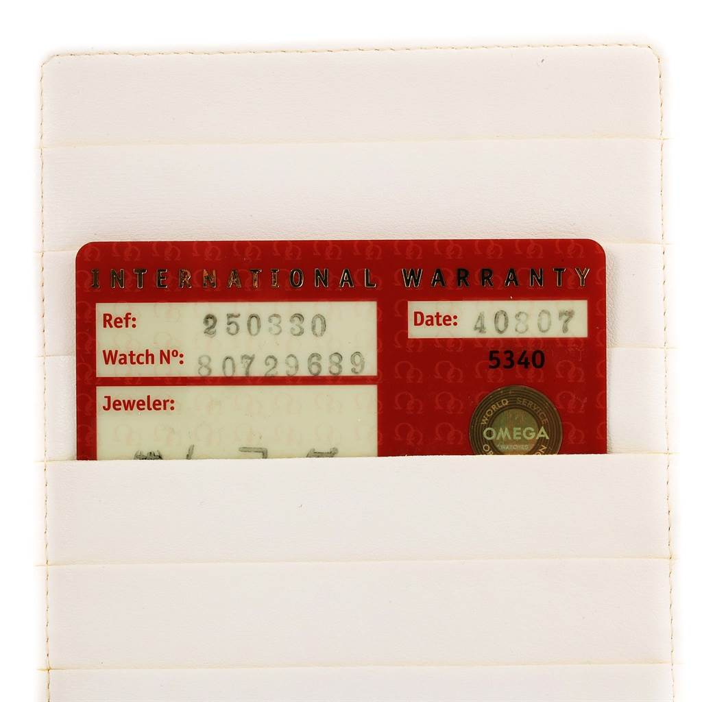 The image shows an Omega Aqua Terra 2503.33.00 Men
s Stainless Steel Silver Dial 2503.33.00 Men
s Stainless Steel Silver Dial international warranty card partially inserted into a white holder, viewed from the front.