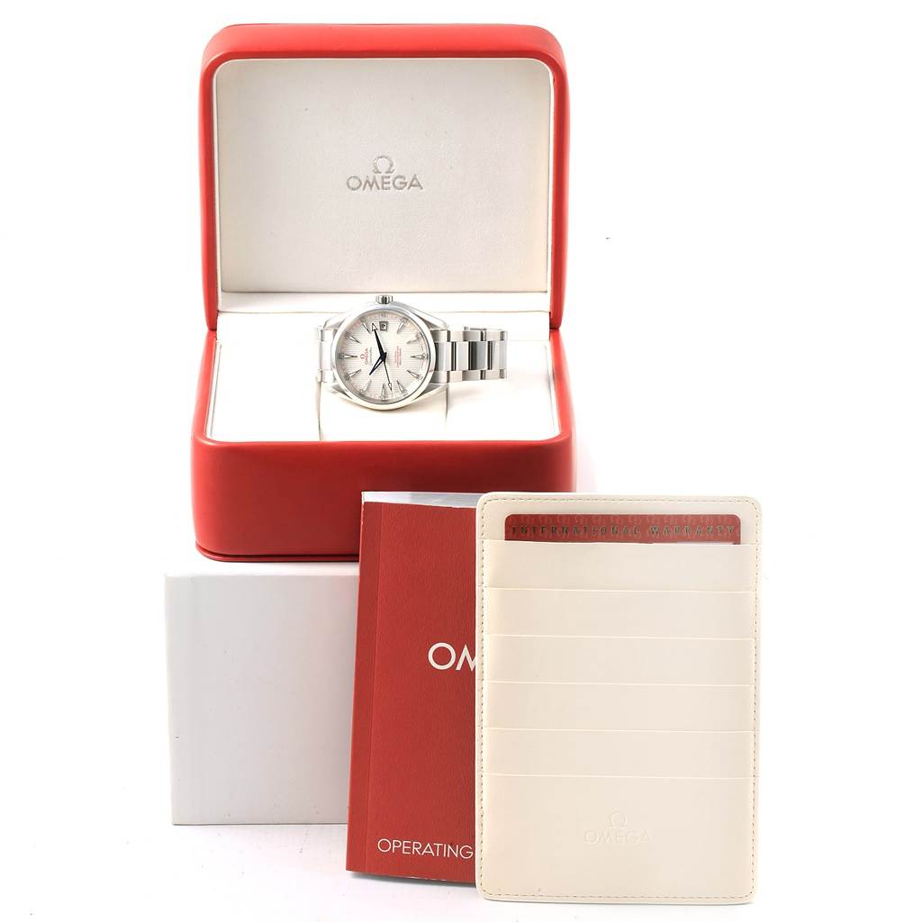The image shows an Omega Aqua Terra 231.10.42.21.02.002 Men
s Stainless Steel Silver Dial 231.10.42.21.02.002 Men
s Stainless Steel Silver Dial watch in its red box, along with an operating manual and a white card holder.