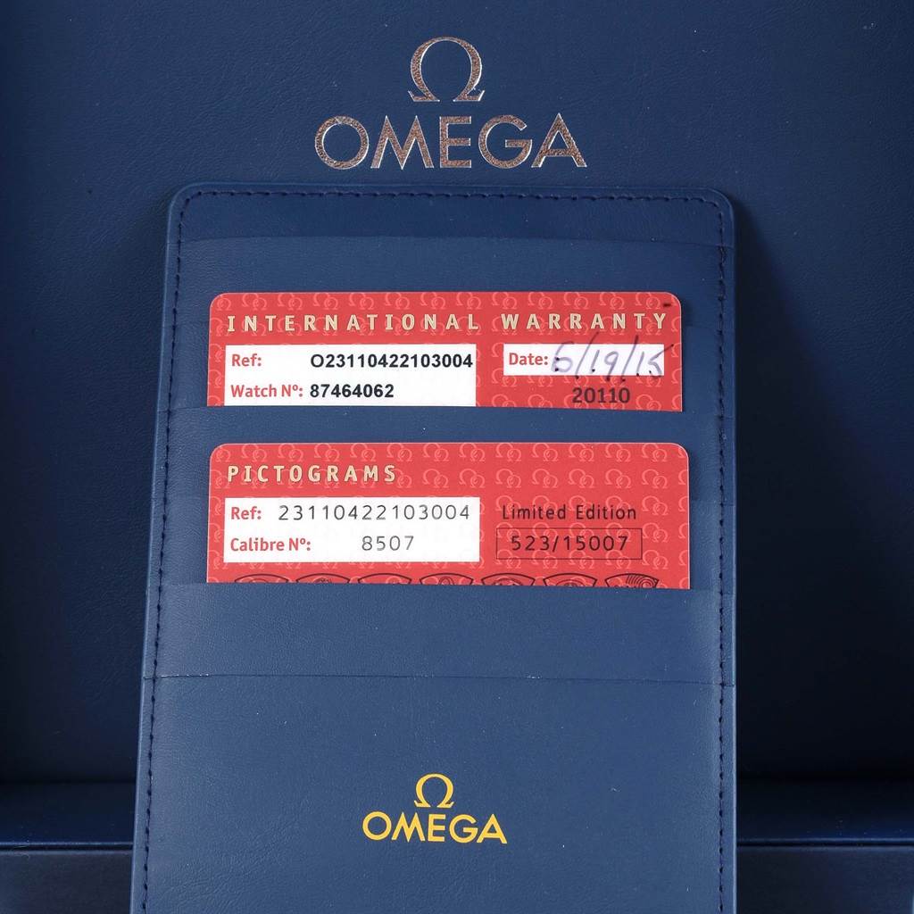 The image shows warranty cards and pictogram card for the Omega Aqua Terra 231.10.42.21.03.004 Men's Stainless Steel Blue Dial 231.10.42.21.03.004 Men's Stainless Steel Blue Dial model in a blue Omega cardholder.
