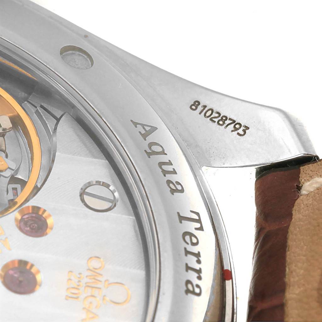 This close-up image shows part of the back and edge of an Omega Aqua Terra 2806.52.37 Men's Stainless Steel Black Dial 2806.52.37 Men's Stainless Steel Black Dial watch, including the serial number and branding.