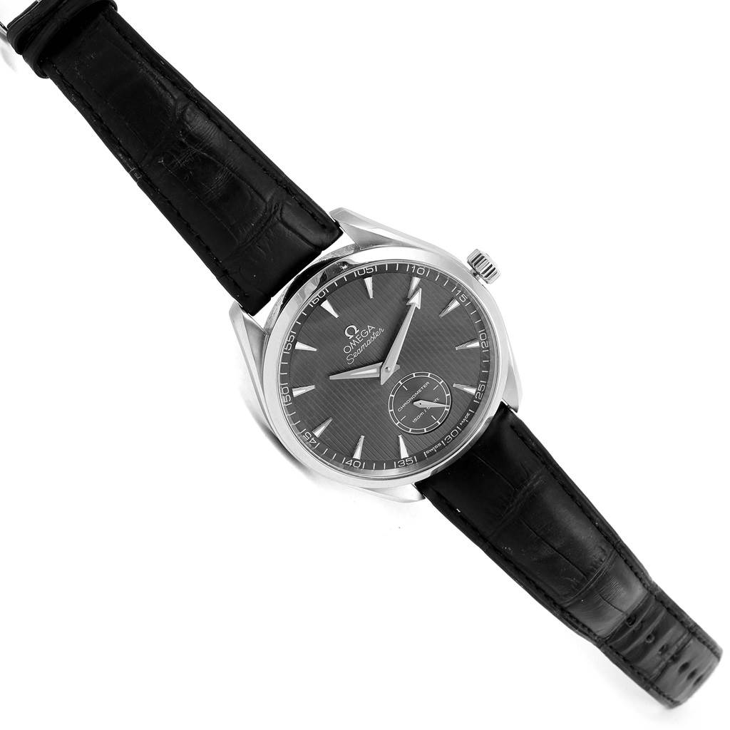 The Omega Aqua Terra 231.13.49.10.06.001 Men's Stainless Steel Grey Dial 231.13.49.10.06.001 Men's Stainless Steel Grey Dial watch is shown from a top-down angle, highlighting its black leather strap and black dial with silver markers.