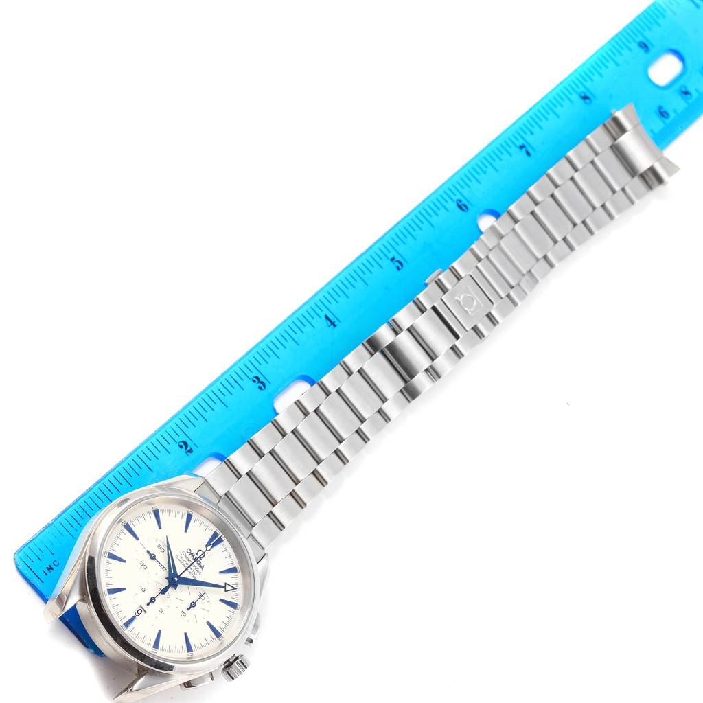 The Omega Aqua Terra 2512.30.00 Men
s Stainless Steel Silver Dial 2512.30.00 Men
s Stainless Steel Silver Dial watch is shown partially from above, displaying its face, bracelet, and a blue ruler for scale.