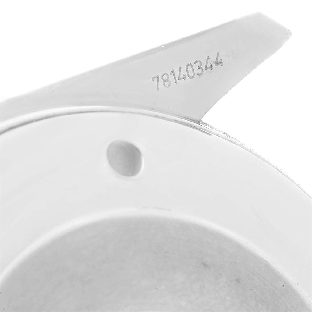 The image shows a close-up of a component with a serial number from the Omega Aqua Terra 2512.30.00 Men
s Stainless Steel Silver Dial 2512.30.00 Men
s Stainless Steel Silver Dial watch model.