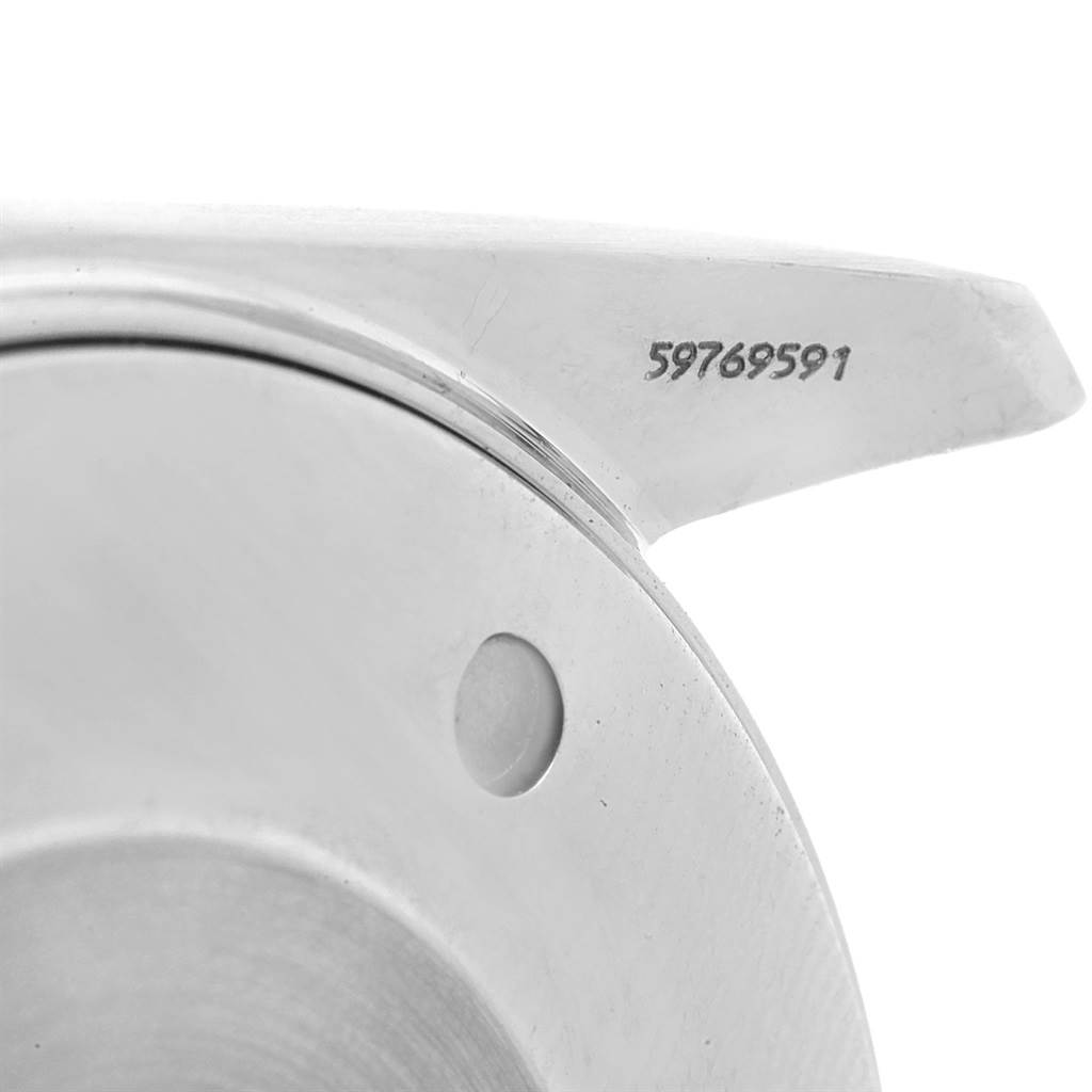 This close-up image of the Omega Aqua Terra 2317.30.00 Men
s Steel and Gold (two tone) Silver Dial 2317.30.00 Men
s Steel and Gold (two tone) Silver Dial watch shows its lugs and serial number located on the side.