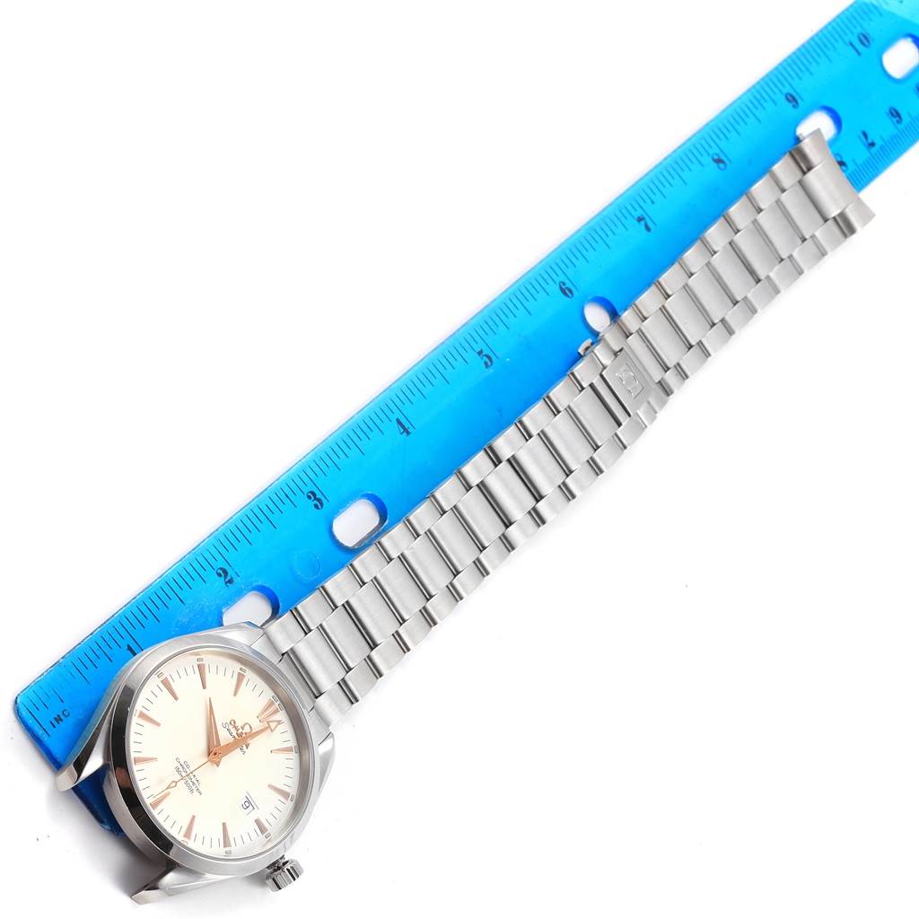 The Omega Aqua Terra 2502.34.00 Men
s Stainless Steel Silver Dial 2502.34.00 Men
s Stainless Steel Silver Dial watch is shown from a top-down angle, displaying the face, bezel, and metal bracelet alongside a ruler for scale.