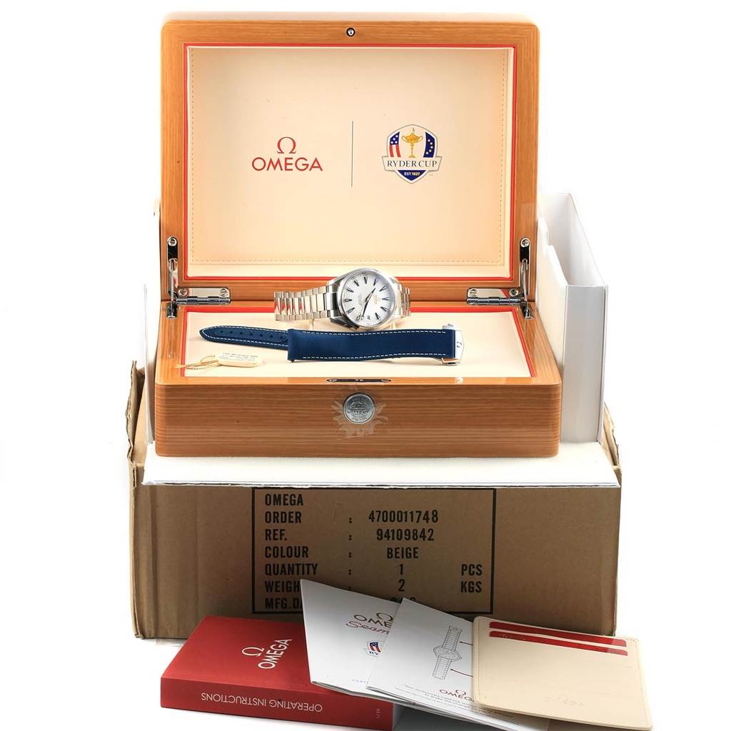 The Omega Aqua Terra 231.10.42.21.02.005 Men
s Stainless Steel Silver Dial 231.10.42.21.02.005 Men
s Stainless Steel Silver Dial watch and additional strap are displayed in an open wooden box with the Omega logo and Ryder Cup emblem.