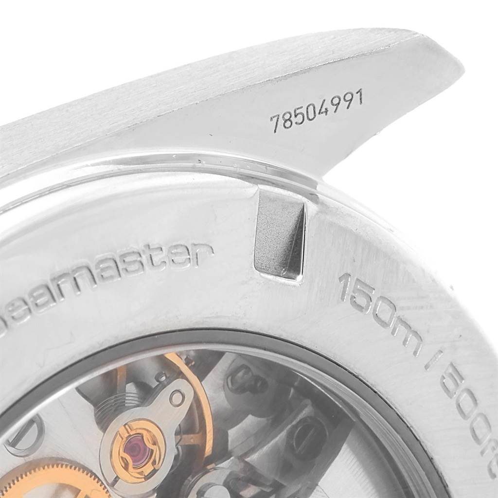 This image shows a close-up of the back case of the Omega Seamaster Aqua Terra watch, revealing part of its internal mechanism and engravings.
