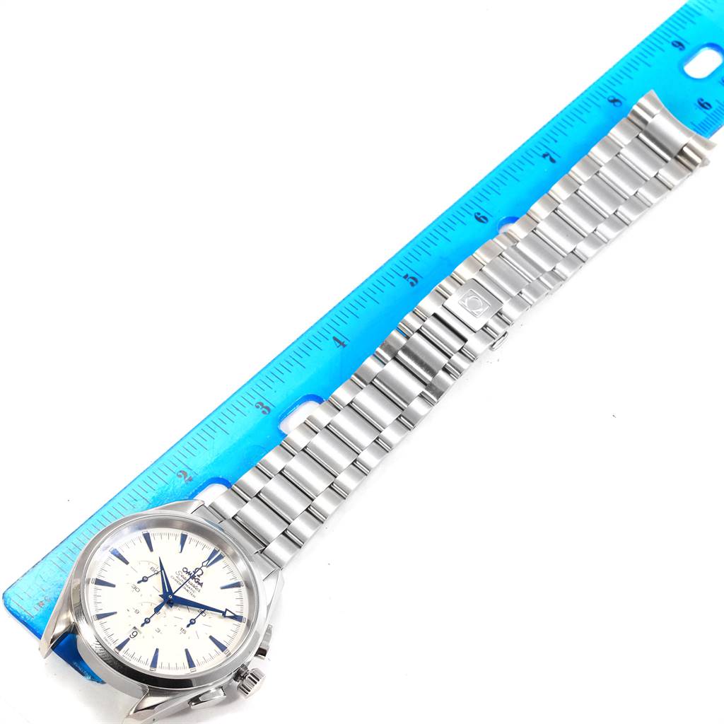 The Omega Aqua Terra 2512.30.00 Men
s Stainless Steel Silver Dial 2512.30.00 Men
s Stainless Steel Silver Dial watch is shown from an overhead angle, featuring the watch face and metal bracelet next to a ruler.