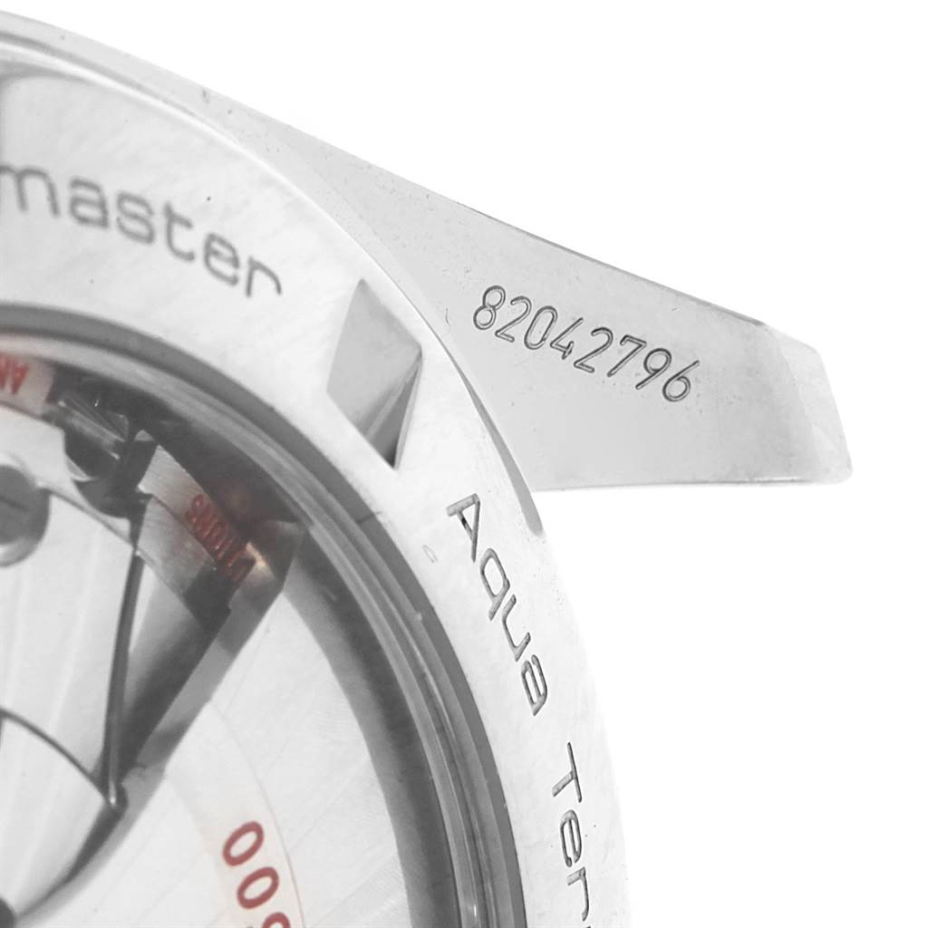 The image shows a close-up of an Omega Aqua Terra 231.10.42.21.02.001 Men
s Stainless Steel Silver Dial 231.10.42.21.02.001 Men
s Stainless Steel Silver Dial watch focusing on the caseback and part of the lug, displaying the serial number.