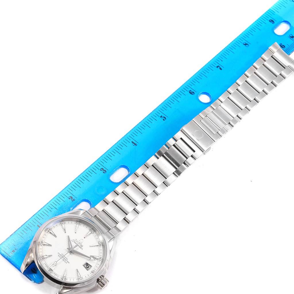 The image shows the Omega Aqua Terra 231.10.42.21.02.001 Men
s Stainless Steel Silver Dial 231.10.42.21.02.001 Men
s Stainless Steel Silver Dial watch face and partially the band, measured with a blue ruler.