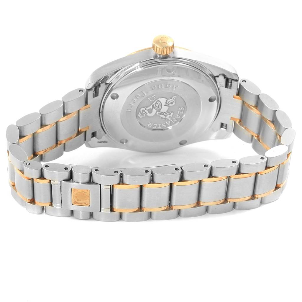 The image shows the back case and bracelet of the Omega Aqua Terra 2318.30.00 Men
s Steel and Gold (two tone) Silver Dial 2318.30.00 Men
s Steel and Gold (two tone) Silver Dial watch at an angle that highlights the rear engraving and clasp.
