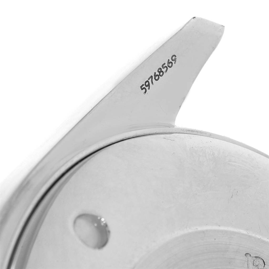 This image shows a close-up of the case back and serial number of an Omega Aqua Terra 2317.30.00 Men's Steel and Gold (two tone) Silver Dial 2317.30.00 Men's Steel and Gold (two tone) Silver Dial watch.