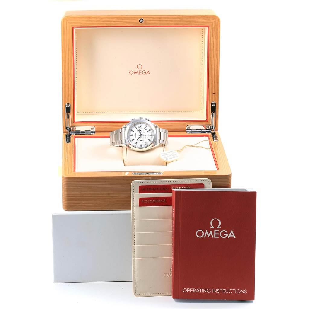 The Omega Aqua Terra 231.10.44.50.04.001 Men
s Stainless Steel White Dial 231.10.44.50.04.001 Men
s Stainless Steel White Dial watch is displayed in an open wooden box with accompanying documentation and operating instructions.