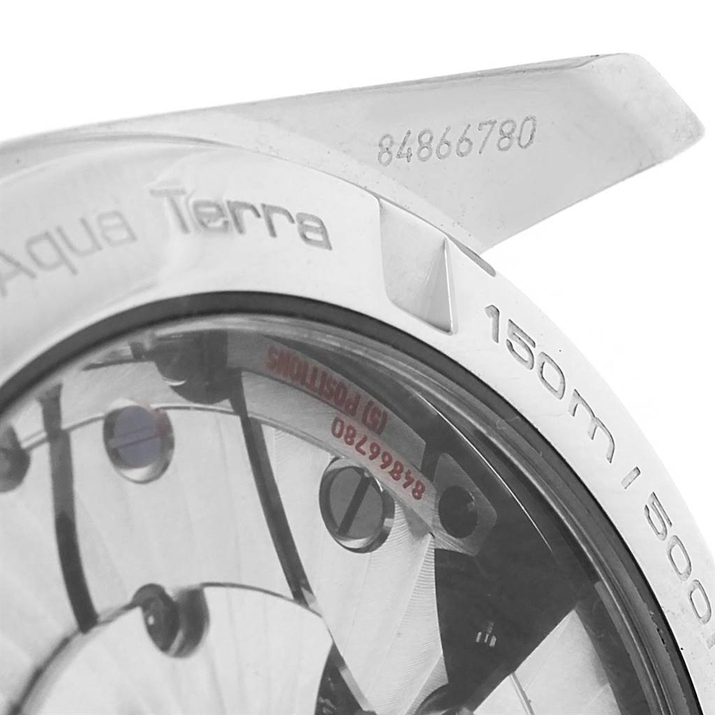 This image shows a close-up of the back casing and part of the lug of the Omega Aqua Terra 231.10.39.21.55.001 Men's Stainless Steel Mother of Pearl Dial 231.10.39.21.55.001 Men's Stainless Steel Mother of Pearl Dial watch, highlighting the serial number and depth rating.