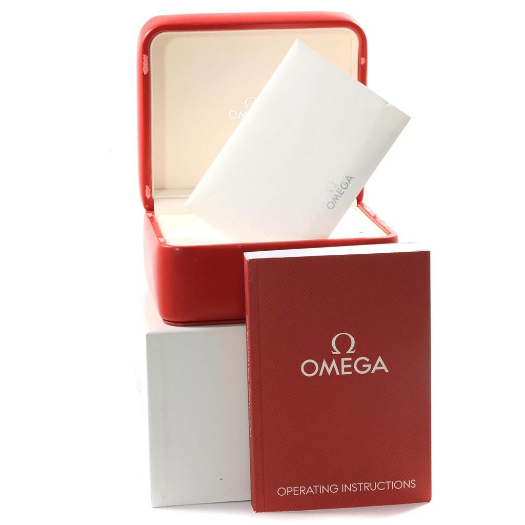 The image shows the red Omega Aqua Terra 231.10.39.21.55.001 Men's Stainless Steel Mother of Pearl Dial 231.10.39.21.55.001 Men's Stainless Steel Mother of Pearl Dial watch box, an instruction booklet, and a document envelope.