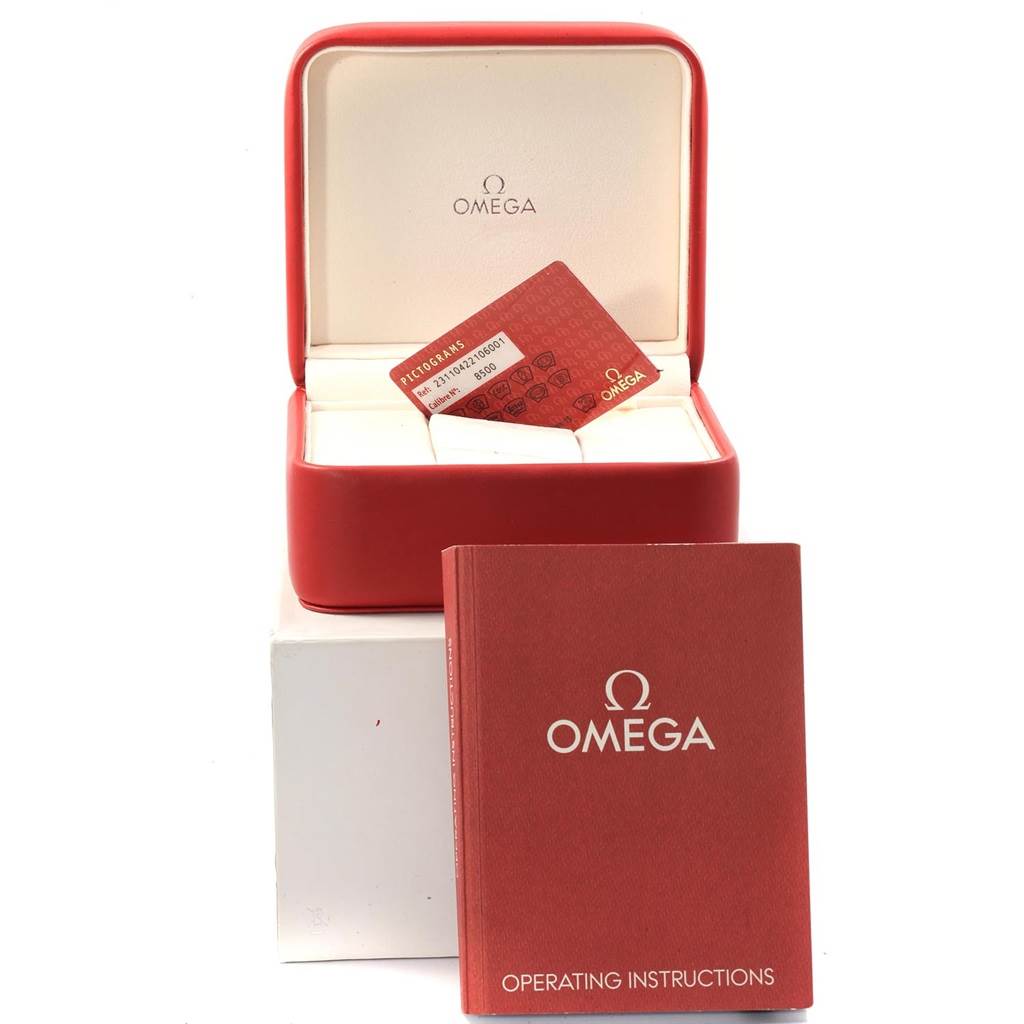 The image shows the packaging and accessories of the Omega Aqua Terra 231.10.42.21.02.003 Men
s Stainless Steel Silver Dial 231.10.42.21.02.003 Men
s Stainless Steel Silver Dial model, including the box, a card, and an operating instructions booklet.