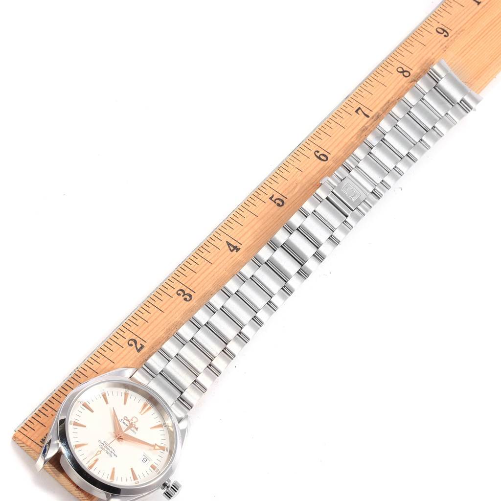 The image shows an Omega Aqua Terra 2503.34.00 Men
s Stainless Steel Silver Dial 2503.34.00 Men
s Stainless Steel Silver Dial watch laid flat, measured alongside a ruler from its face to the end of its metal bracelet.