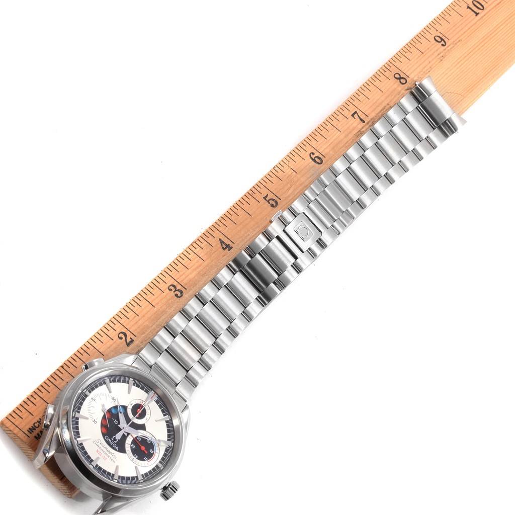 The Omega Aqua Terra 2513.30.00 Men
s Stainless Steel Silver Dial 2513.30.00 Men
s Stainless Steel Silver Dial watch is photographed from above, showing its face, bracelet, and part of a wooden ruler for measurement.