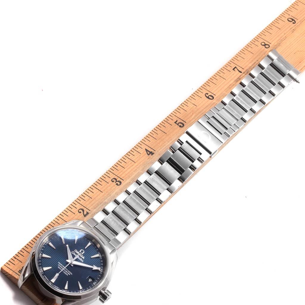 The Omega Aqua Terra 231.10.39.21.03.002 Men's Stainless Steel Blue Dial 231.10.39.21.03.002 Men's Stainless Steel Blue Dial watch is shown from a top angle, with its blue dial, full bracelet, and a ruler for scale.
