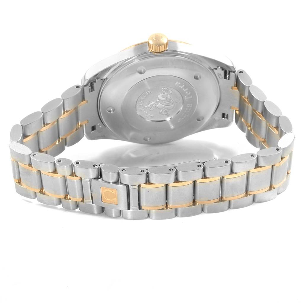 The image shows the back view of an Omega Aqua Terra 2317.30.00 Men's Steel and Gold (two tone) Silver Dial 2317.30.00 Men's Steel and Gold (two tone) Silver Dial watch, highlighting the case back, crown, and two-tone metal bracelet.