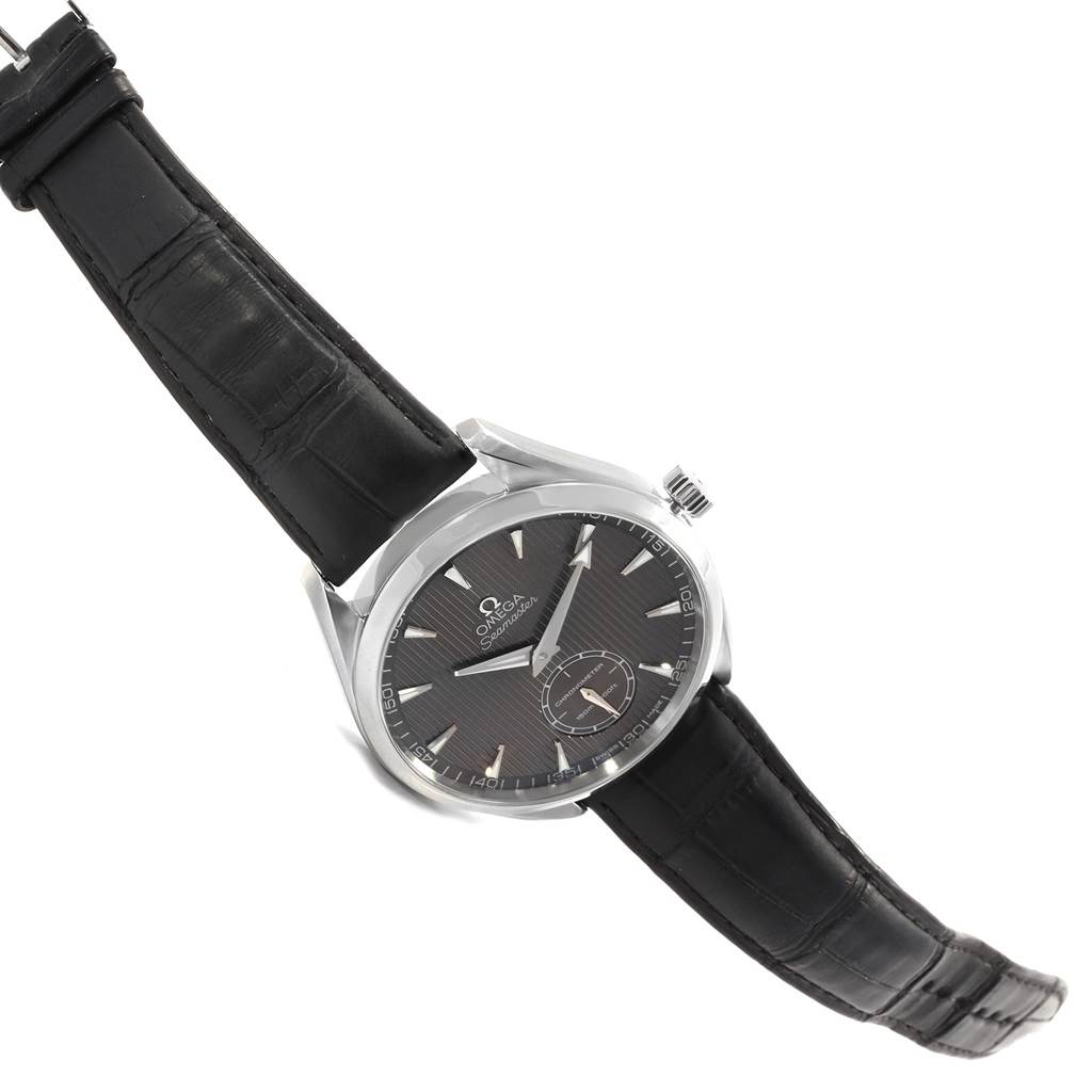 The image shows an angled view of an Omega Aqua Terra 231.13.49.10.06.001 Men's Stainless Steel Grey Dial 231.13.49.10.06.001 Men's Stainless Steel Grey Dial watch, highlighting its black strap and partially its face.